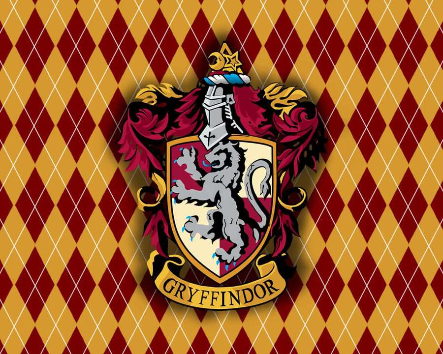 Gryffindor house crest with silver lion on shield against red and gold diamond pattern background. — Harry Potter Gryffindor Wallpaper