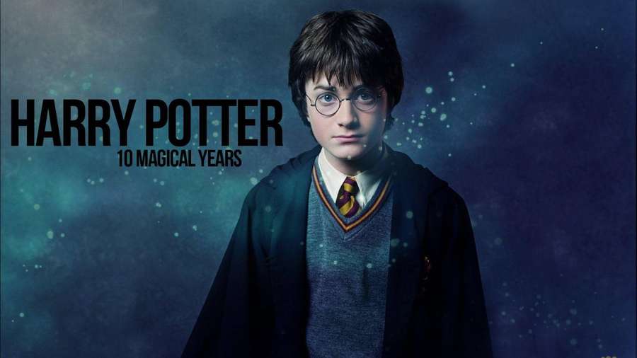 Harry Potter in Hogwarts uniform against magical blue background with floating sparks. — Harry Potter iPad Wallpaper