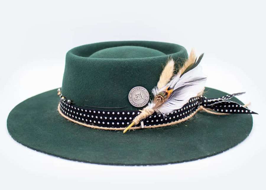 Dark green felt hat with black polka dot ribbon and feathers. — Hat Wallpaper
