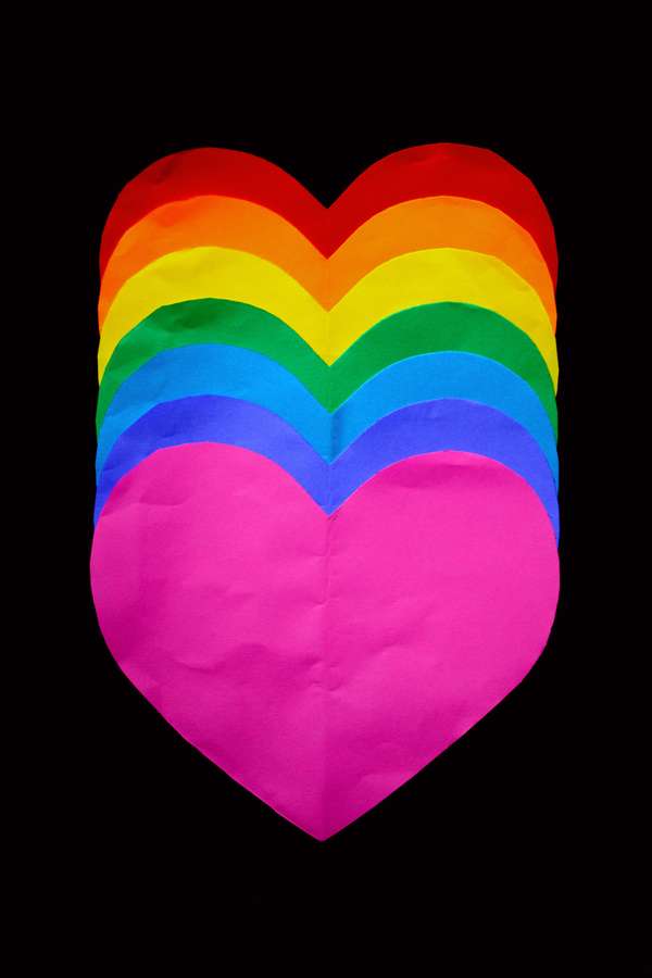 A layered rainbow heart made of paper against a black background. — Heart iPhone Wallpaper