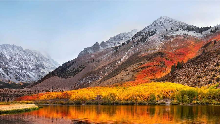 Snowy mountains behind autumn trees reflecting in a calm lake. — High Sierra Wallpaper