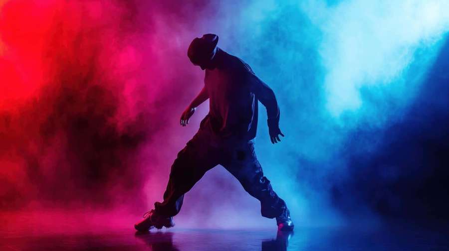 Dancer in silhouette performing under red and blue stage lights with smoke. — Hip Hop Dance Wallpaper