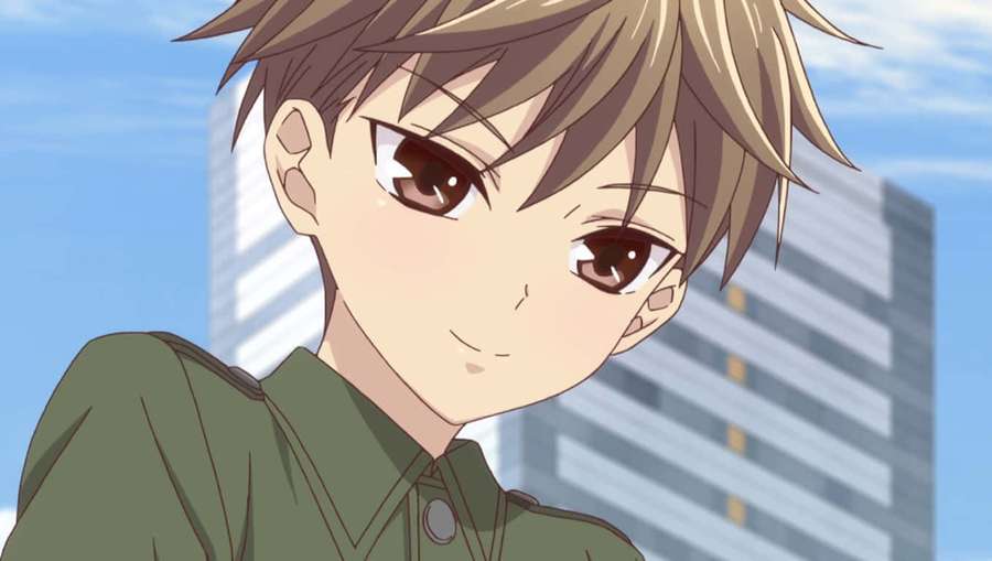 Anime-hahmo, jolla on ruskeat silmät ja vihreä paita, hymyilee kaupunkitaustalla. — Hiro Sohma Taustakuvat