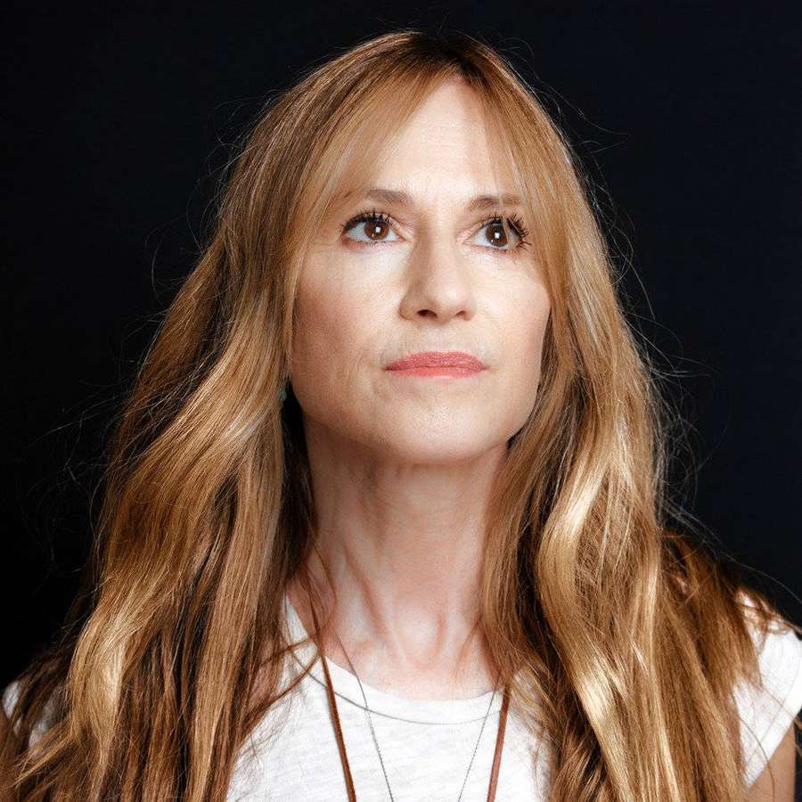 Woman with long blonde hair looking upward in a studio portrait. — Holly Hunter Wallpaper