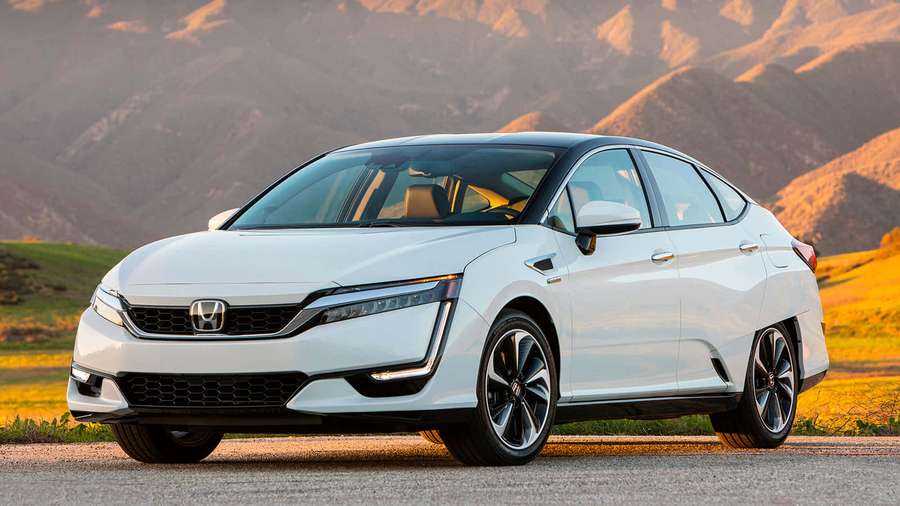 White Honda Clarity Plug-in Hybrid parked on a scenic mountain road at sunset. — Honda Clarity Wallpaper