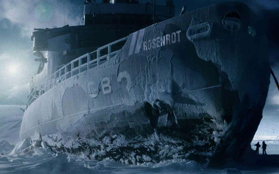 Two people stand on ice near a giant frozen ship named Rosenrot in Antarctica. — Huge Wallpaper