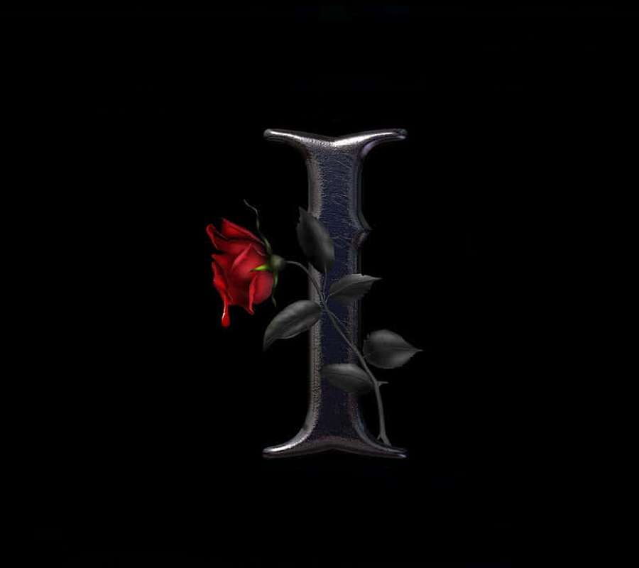 A red rose with dark leaves attached to a metallic letter I on black background. — I Wallpaper