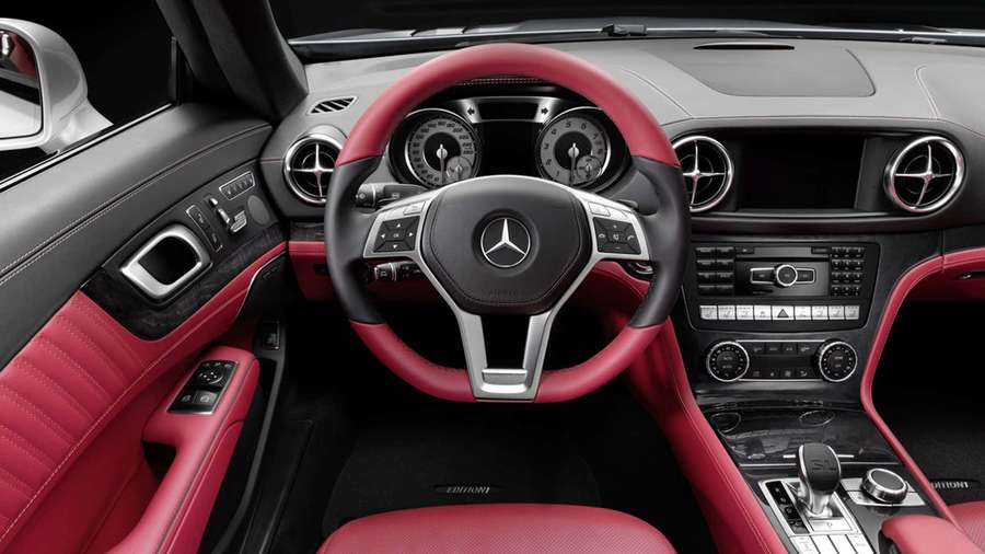 Red leather Mercedes-Benz sports car interior with black dashboard and steering wheel. — Inside Car Background