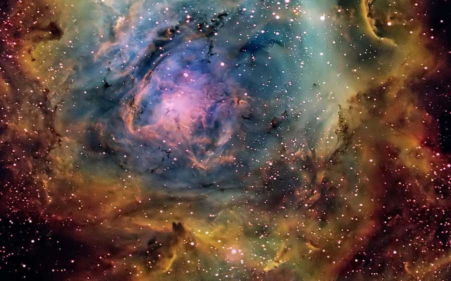 A colorful nebula filled with stars and cosmic dust clouds. — Interstellar Cloud Wallpaper