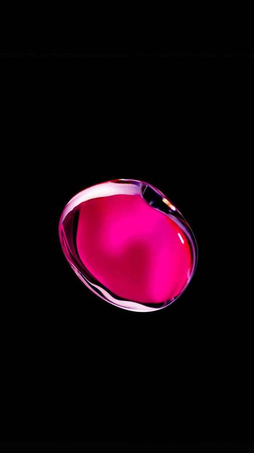 A glowing pink bubble with iridescent highlights against a black background. — iPhone 7 Original Wallpaper