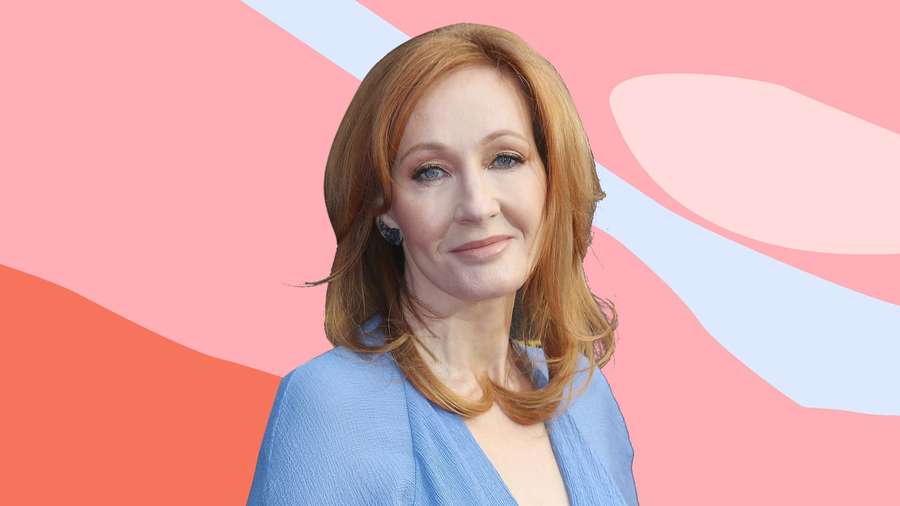 Woman with red hair and blue eyes wearing a blue blouse against a pastel abstract background. — J K Rowling Wallpaper