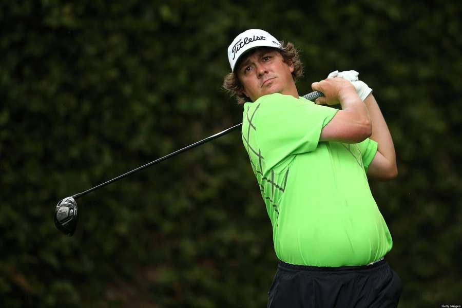 Golfer mid-swing wearing bright green shirt and white cap — Jason Dufner Wallpaper