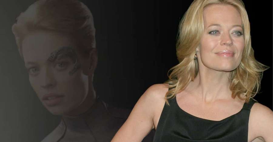 A smiling blonde woman with a faded ghostly portrait of herself with cybernetic markings behind her. — Jeri Ryan Wallpaper