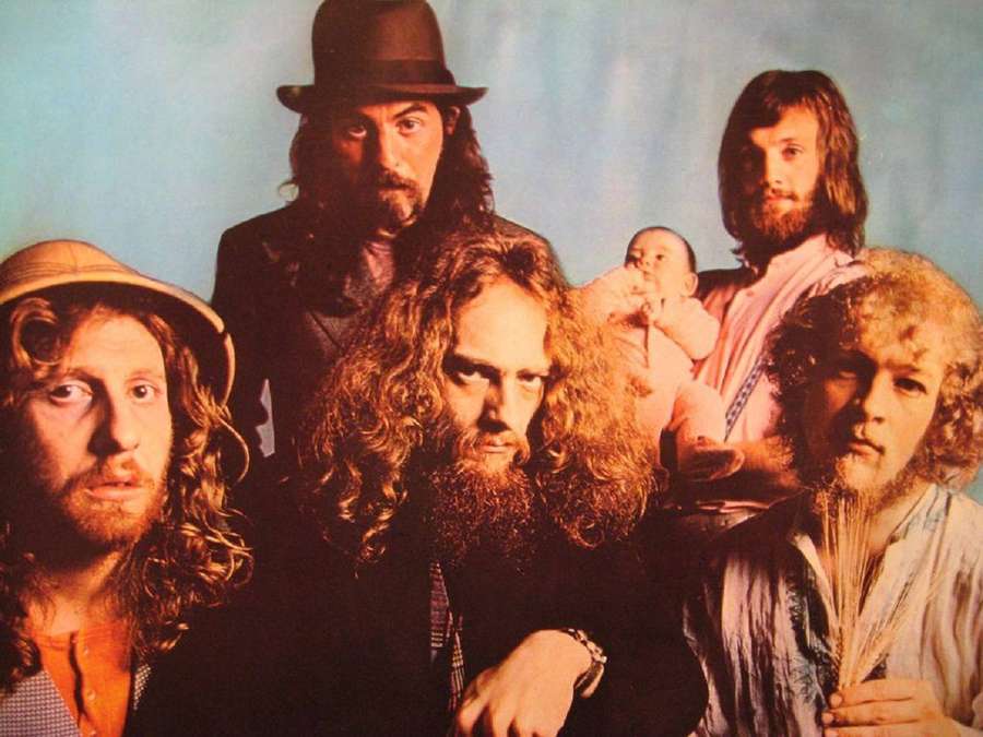 Five bearded men with long hair and a baby in a vintage studio photo. — Jethro Tull Wallpaper