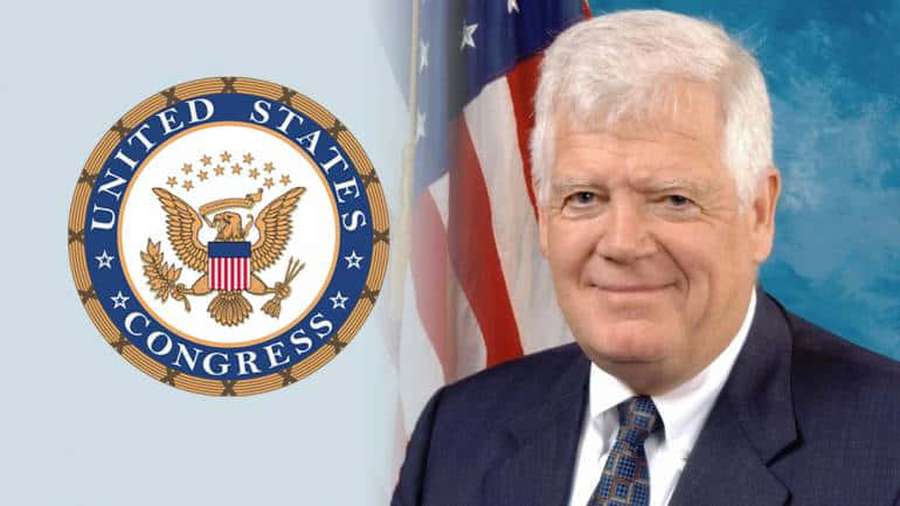 Official portrait of a man in suit beside U.S. Congress seal and flag. — Jim Mcdermott Wallpaper