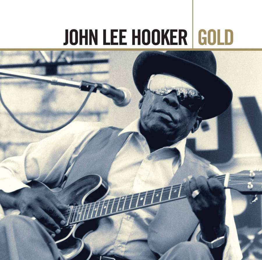 John Lee Hooker spielt Gitarre mit Sonnenbrille und Fedora in Sepiaton. — John Lee Hooker Bilder