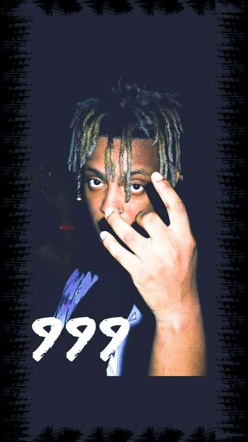 Young man with dreadlocks and nose ring holding hand near face in dark grunge style. — Juice Wrld iPhone Wallpaper