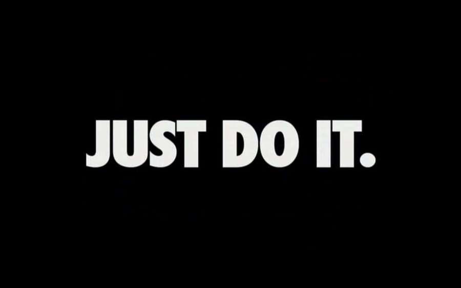 White motivational slogan text JUST DO IT. on black background — Just Wallpaper