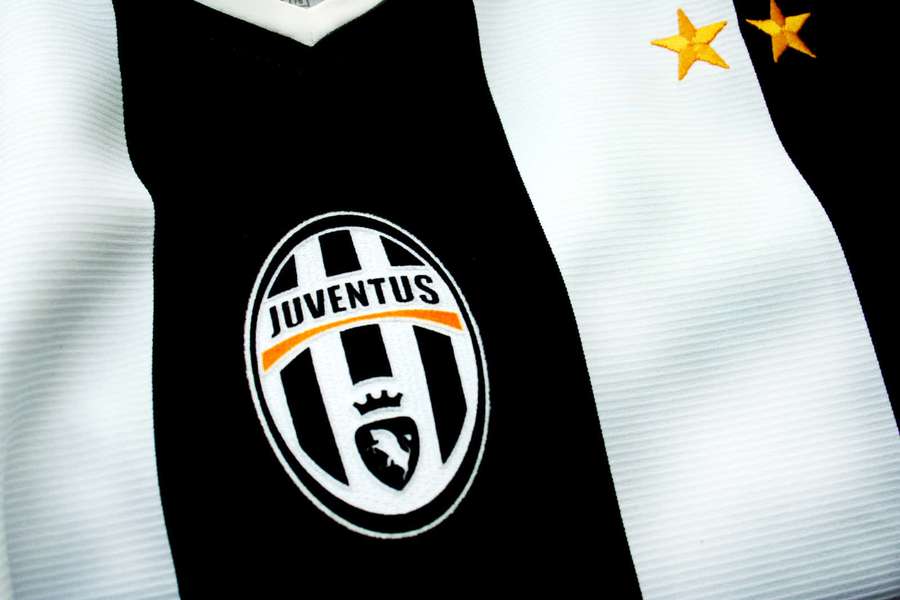Juventus football jersey with black and white stripes and two gold stars. — Juventus Background