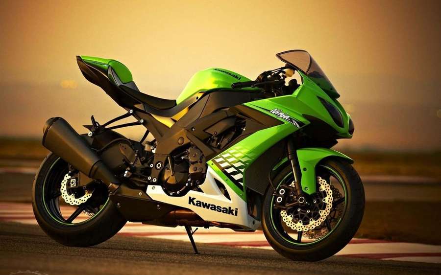 Green Kawasaki Ninja sport motorcycle on racetrack at sunset. — Kawasaki Desktop Wallpaper