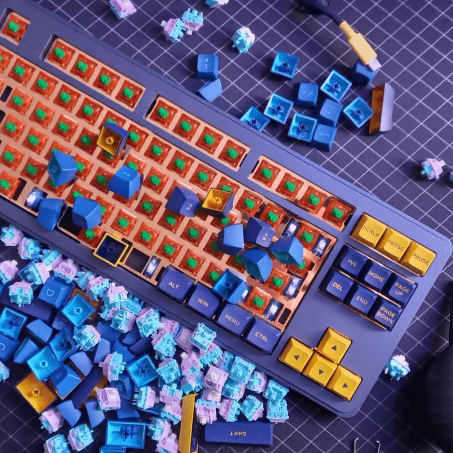 Custom mechanical keyboard with colorful keycaps on a grid mat. — Keyboard Aesthetic Wallpaper