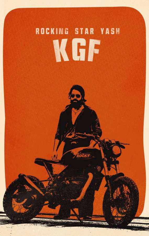 A man with a beard and sunglasses sits on a motorcycle labeled 'ROCKY' against an orange background. — Kgf Bike Wallpaper