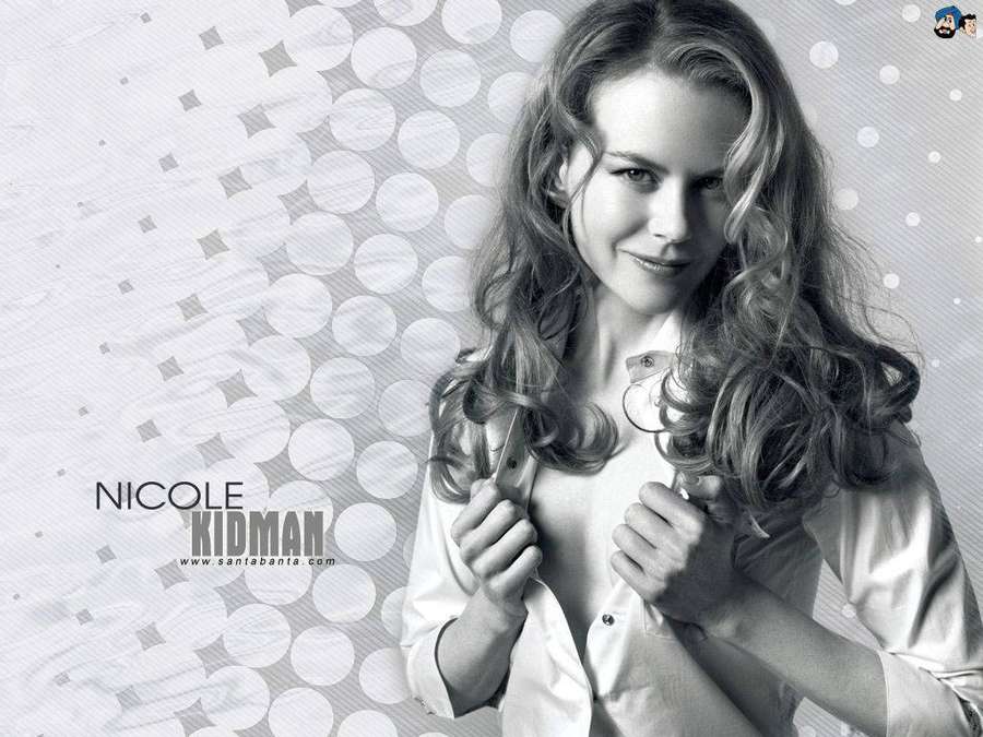 Nicole Kidman unbuttoning her shirt with a gentle smile. — Kidman Wallpaper