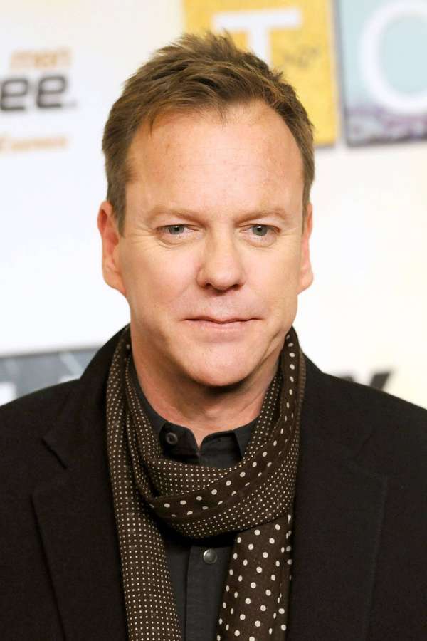 Man in black suit and brown polka dot scarf at event — Kiefer Sutherland Wallpaper