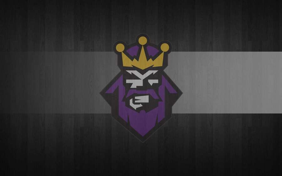 Purple and gold crowned king logo on dark wood background — King Logo Wallpaper