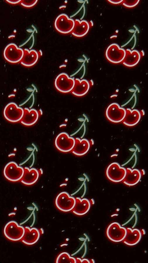 Neonrote Kirschen mit grünen Stielen, die auf einem dunklen, gesprenkelten Hintergrund leuchten. — Kirsche Wallpaper