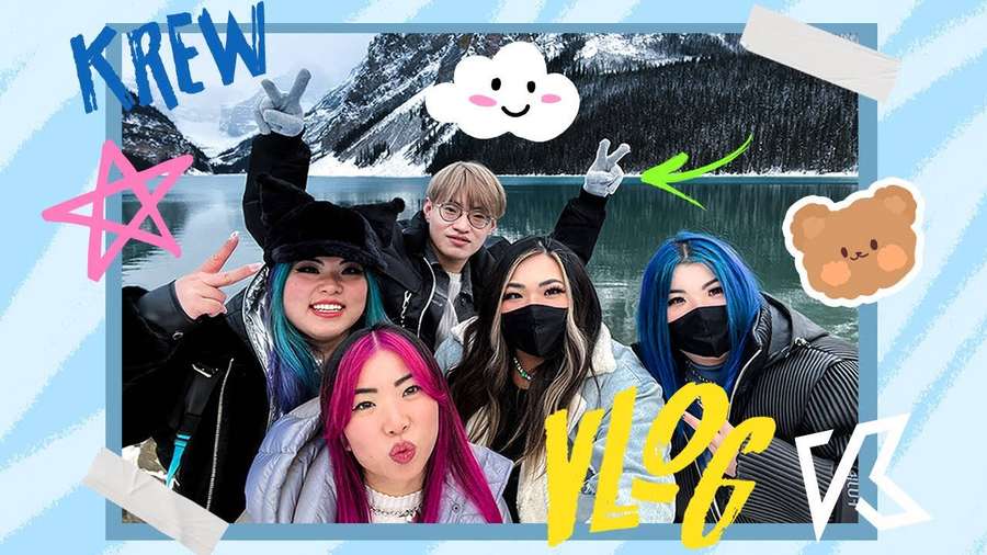 Group of five friends with vibrant hair posing for a vlog in front of a snowy mountain lake. — Krew Background