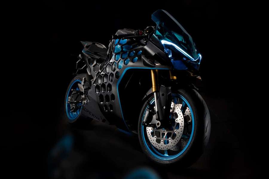 Futuristic black motorcycle with glowing blue accents and hexagonal body panels. — Kymco Wallpaper