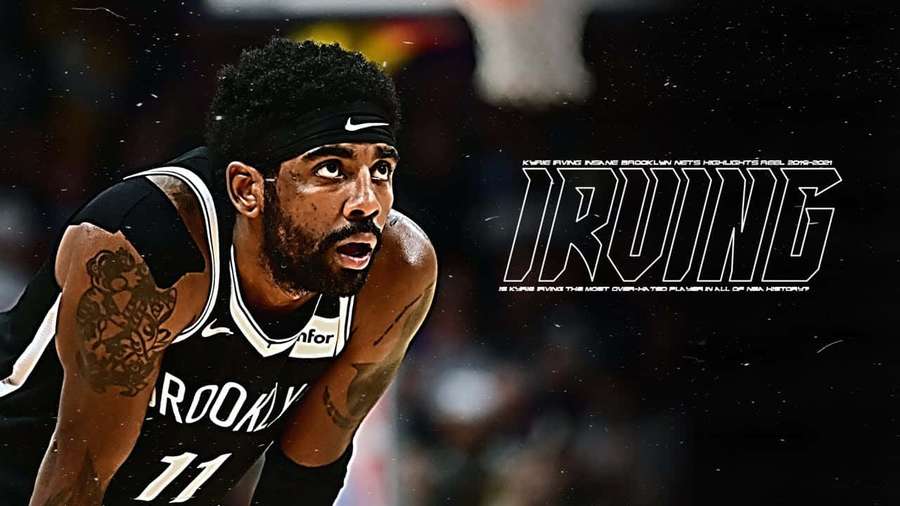 Kyrie Irving con la camiseta de los Brooklyn Nets durante un partido de baloncesto con intenso enfoque. — Kyrie Irving Nets Fondos de pantalla