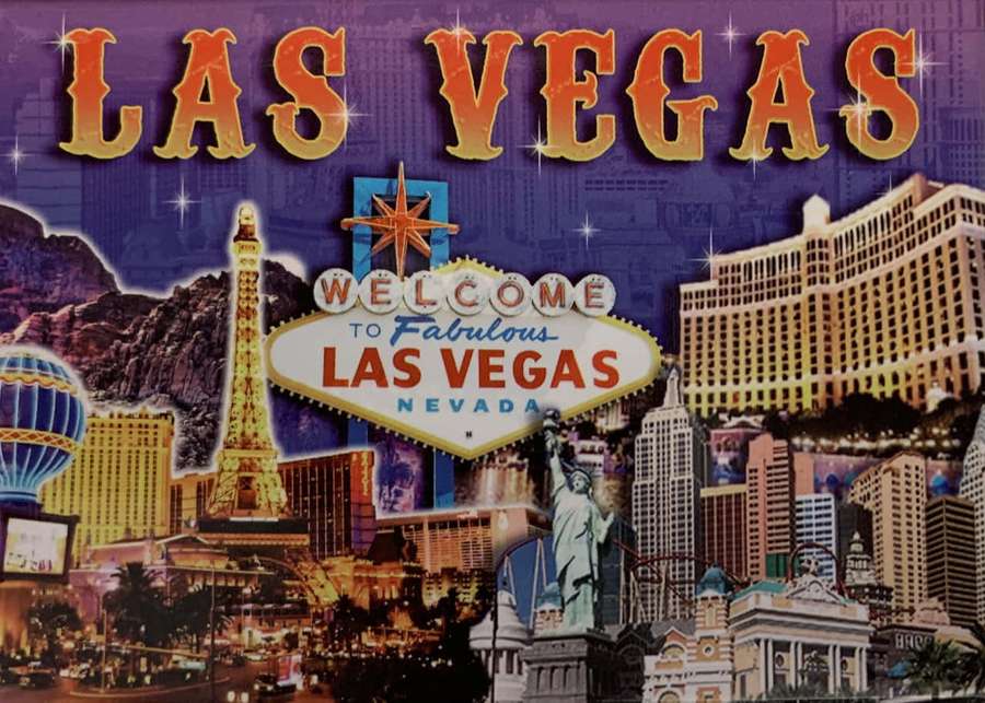 Las Vegas skyline with neon signs and famous landmarks at night. — Las Vegas Background
