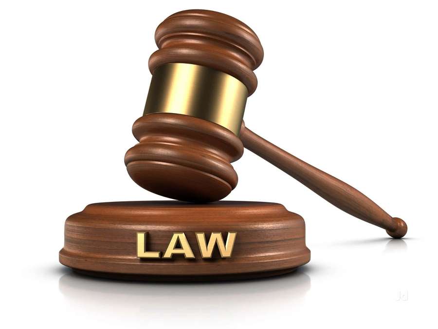 Wooden gavel with gold band on base labeled LAW — Law Background