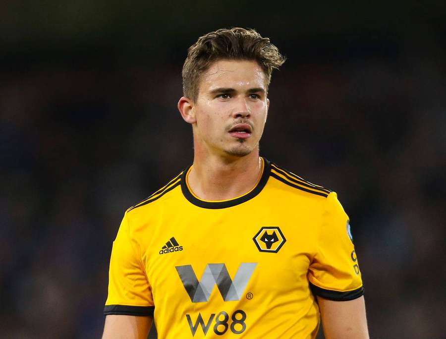 Soccer player in yellow Wolves jersey during a match. — Leander Dendoncker Wallpaper