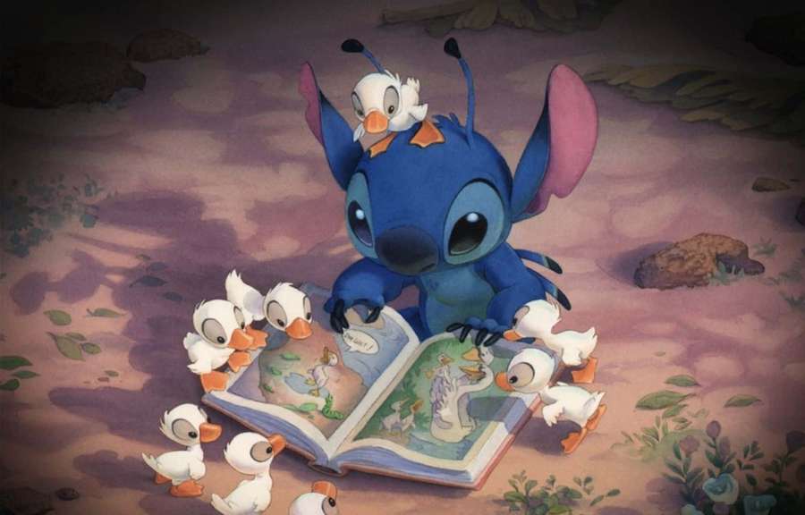 Stitch reads a storybook to ducklings in a twilight setting. — Lilo And Stitch Picture