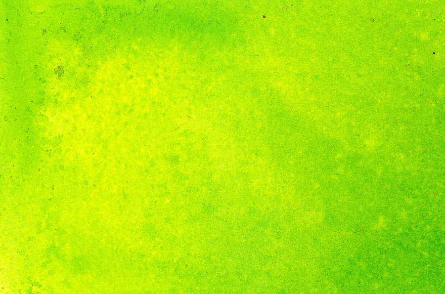 Vibrant lime green textured background with subtle speckles and gradient variations. — Lime Green Background