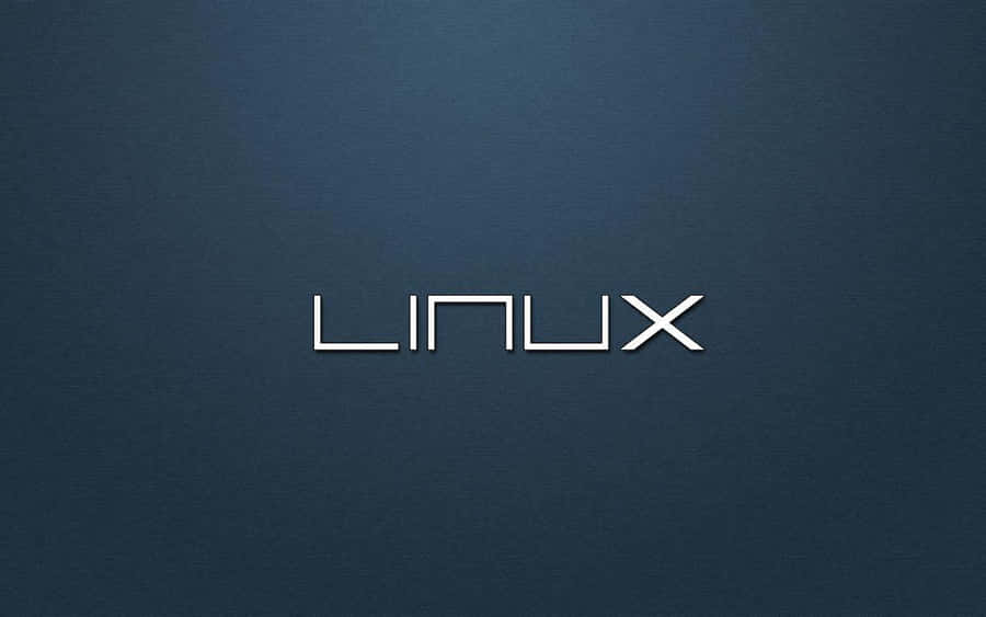 Logo Linux dalam teks putih pada latar belakang biru gelap bertekstur. — Linux Wallpaper