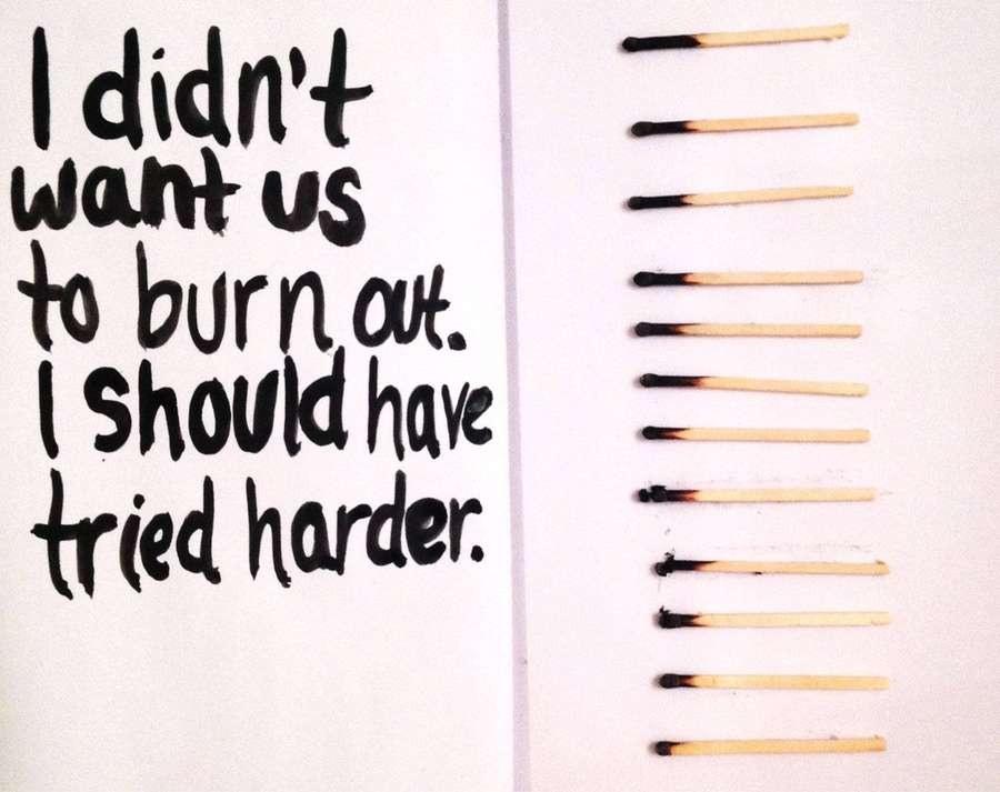 Burnt matchsticks next to handwritten regret text about trying harder. — Lonely Quotes Wallpaper