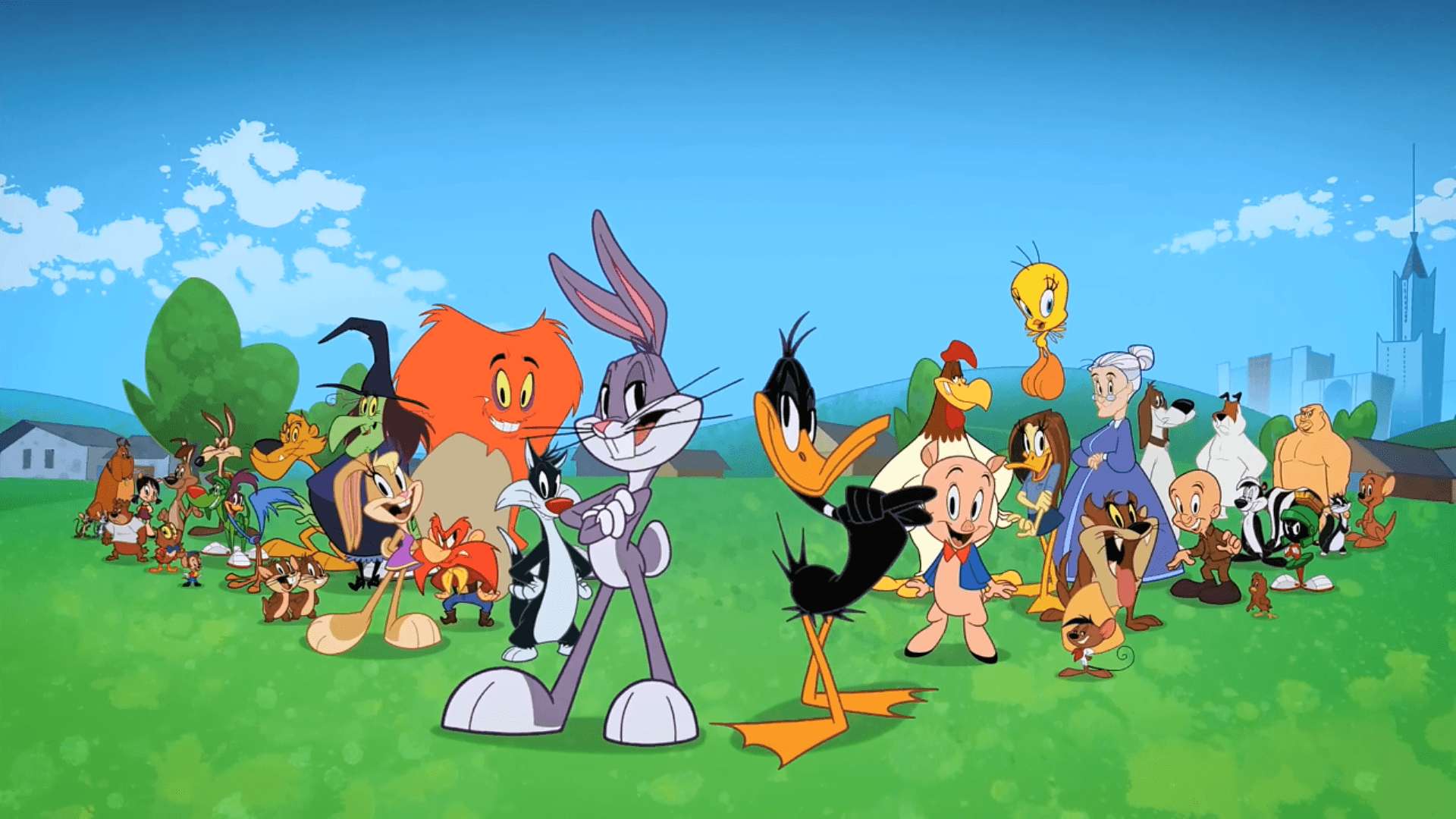 Group of Looney Tunes characters standing on grass under blue sky — Looney Tunes Background