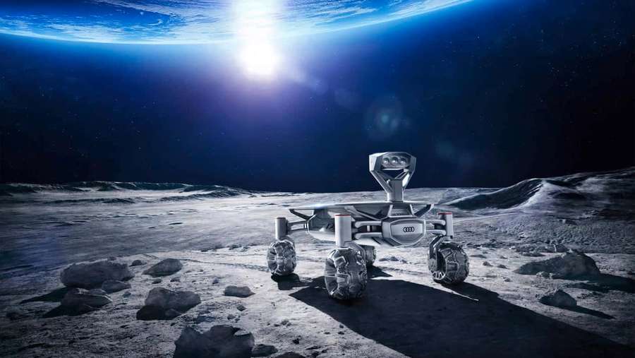 Futuristic Audi rover on the moon with Earth visible in the sky. — Lunar Rover Wallpaper