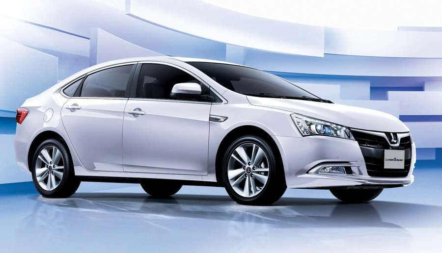 White sedan with chrome details on reflective blue studio floor. — Luxgen Wallpaper