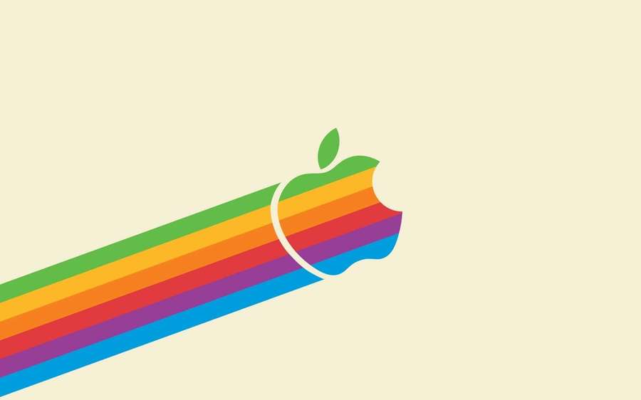 Rainbow Apple logo with bite mark and leaf on pale yellow background. — macOS Background