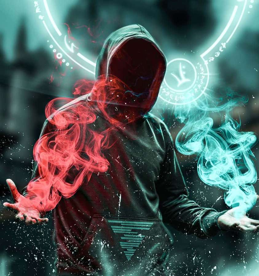 Una persona encapuchada emite energía roja y cian desde sus manos en un entorno digital oscuro. — Magia Fondos de pantalla