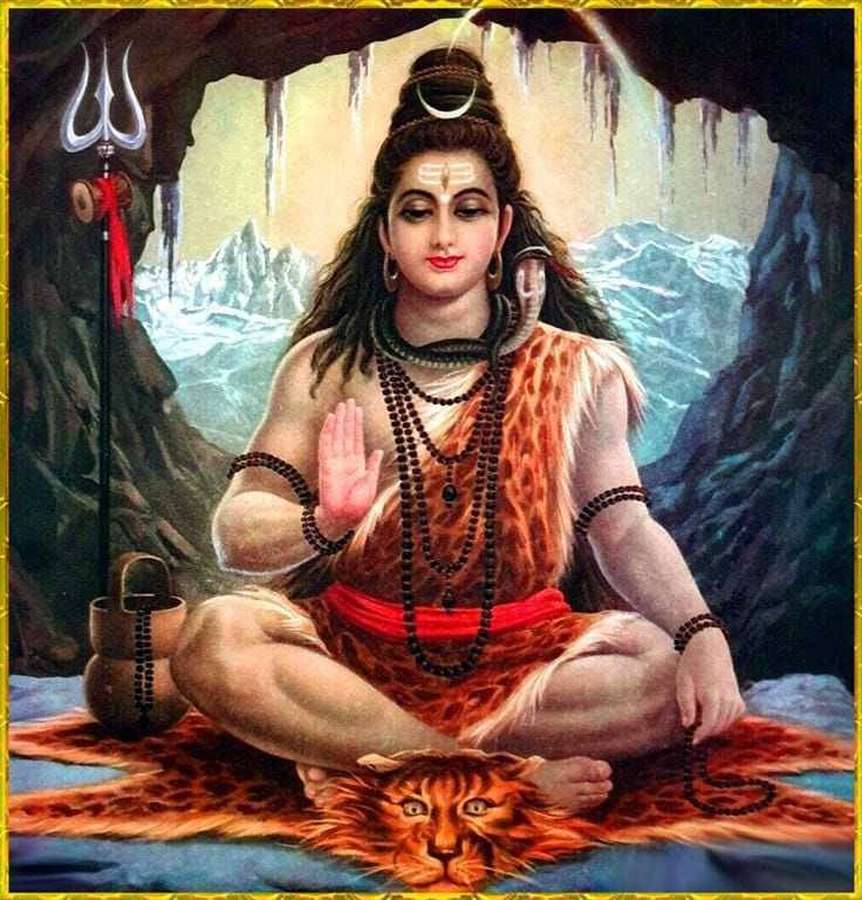 Shiva meditates in a mountain cave with trishul and tiger skin. — Mahakal Wallpaper