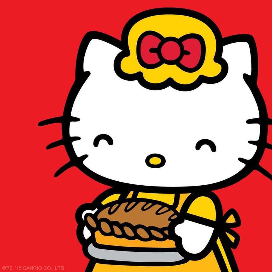 Hello Kitty pitää paistettua piirakkaa keltaisessa mekossa punaista taustaa vasten. — Mary White Taustakuvat
