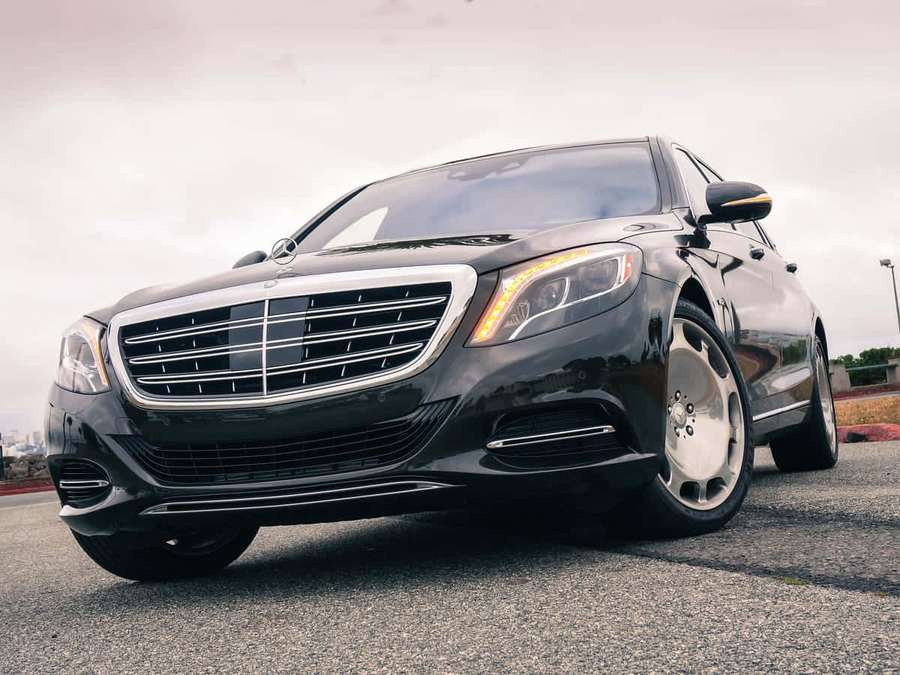 Black luxury sedan with custom wheels parked on asphalt. — Maybach S600 Wallpaper