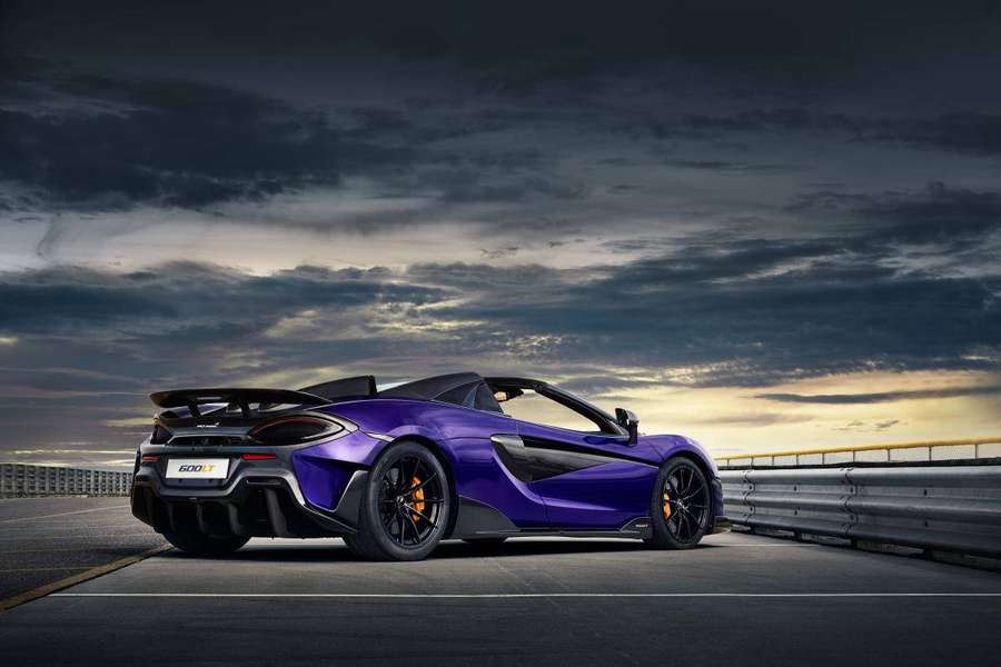 Purple McLaren 600LT Spider on racetrack at sunset. — Mclaren Spyder Wallpaper