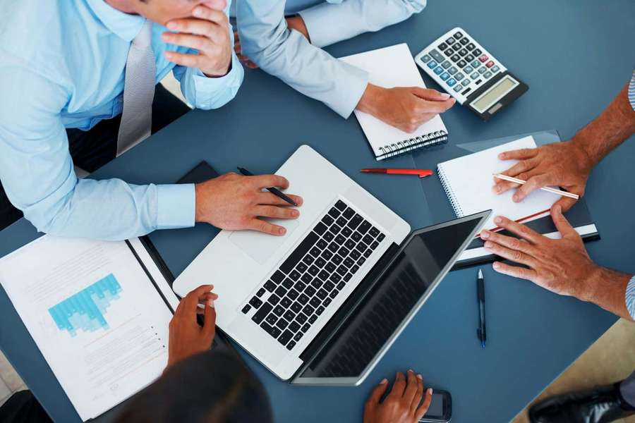 Business team reviewing financial data during a meeting. — Meeting Background